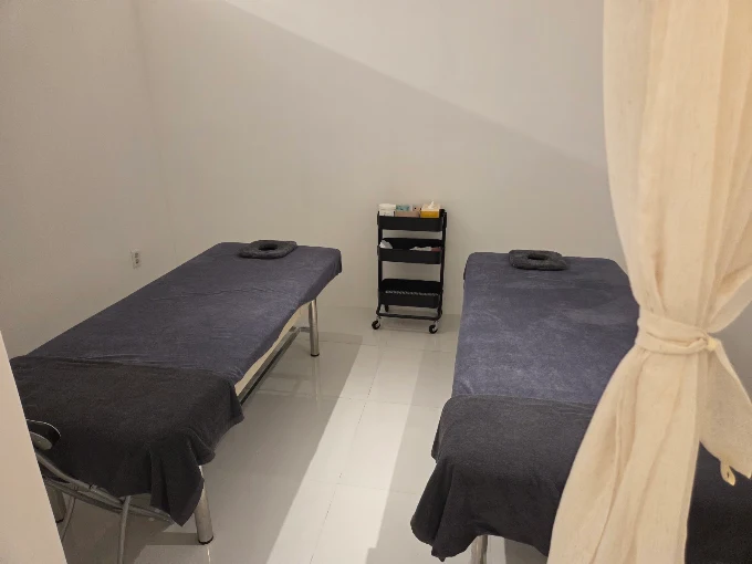 Two massage beds in a private treatment room